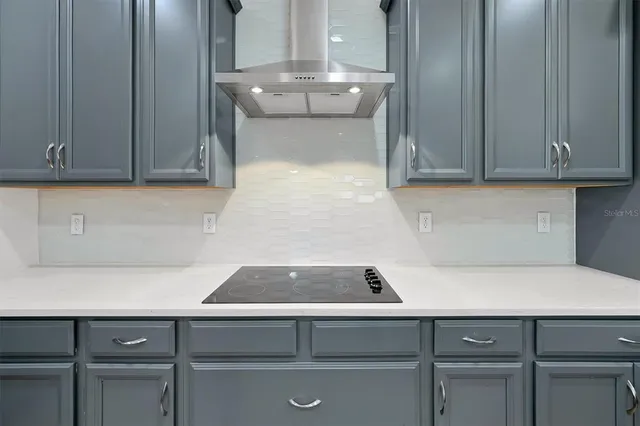 a kitchen with a sink and a microwave