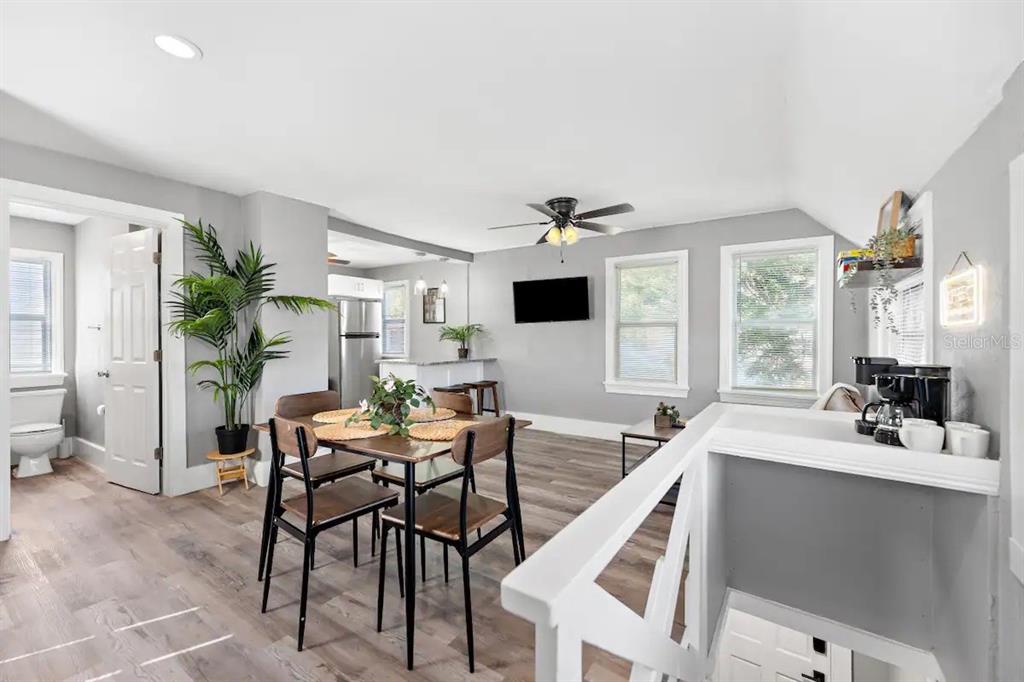 3320 18th Street North St. Petersburg, FL 33713 - Photo 23 of 28 a view of a dining room with furniture window and wooden floor