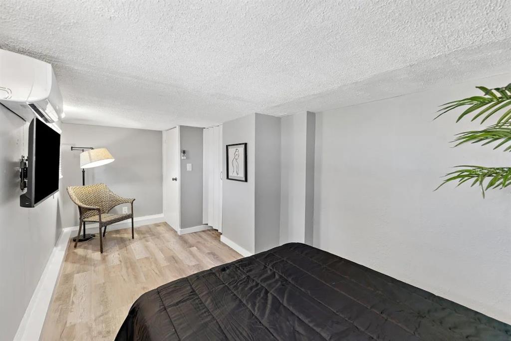 3320 18th Street North St. Petersburg, FL 33713 - Photo 25 of 28 a bedroom with a bed table and a couch