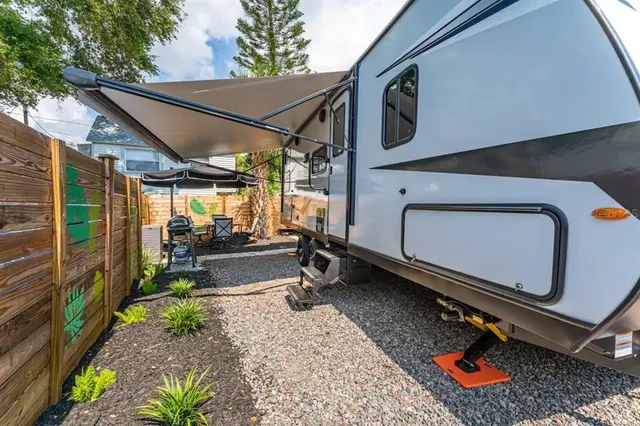 a bedroom with a large bed and a large window