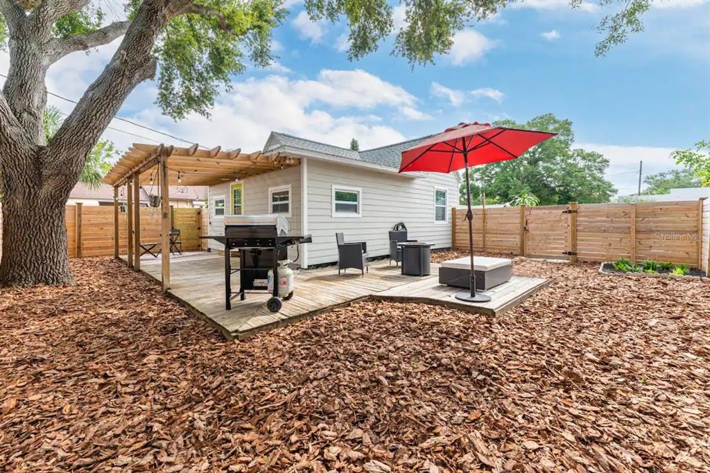 3320 18th Street North St. Petersburg, FL 33713 - Photo 8 of 28 a view of a house with backyard porch and sitting area