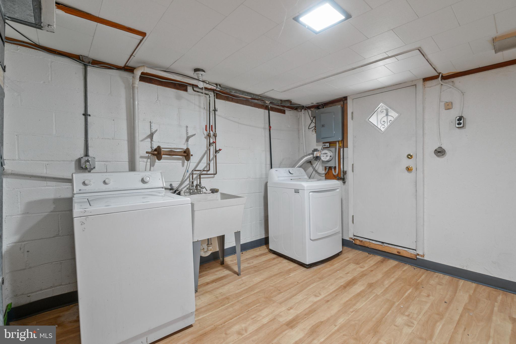 1909 Heathfield Road Baltimore, MD 21239 - Photo 17 of 22 a utility room with dryer and washer