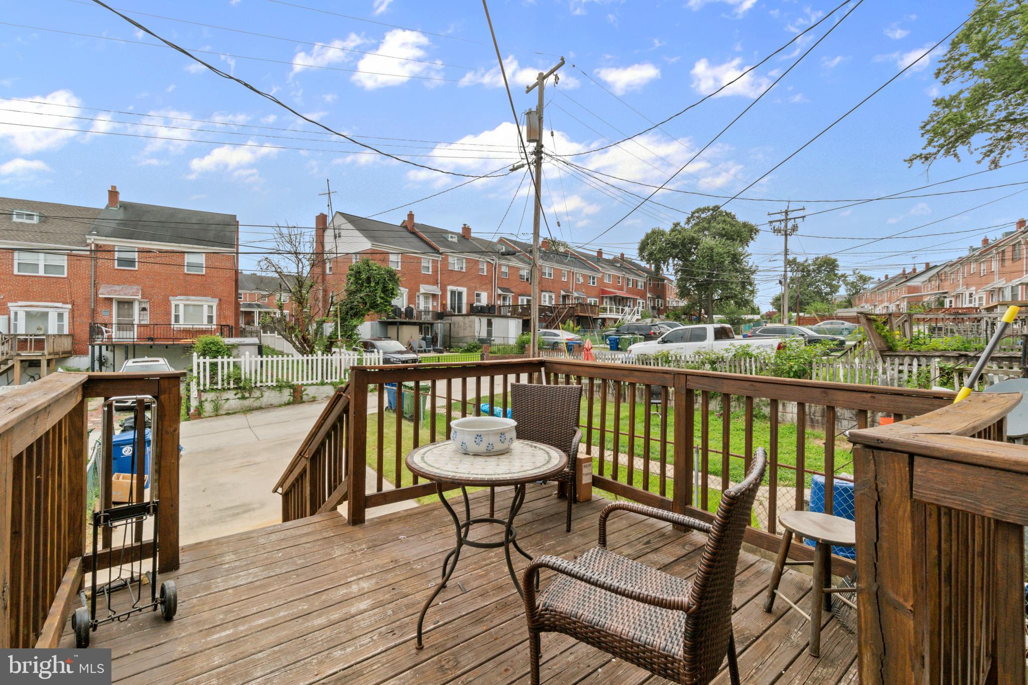 1909 Heathfield Road Baltimore, MD 21239 - Photo 19 of 22 a view of a balcony with a table and chairs