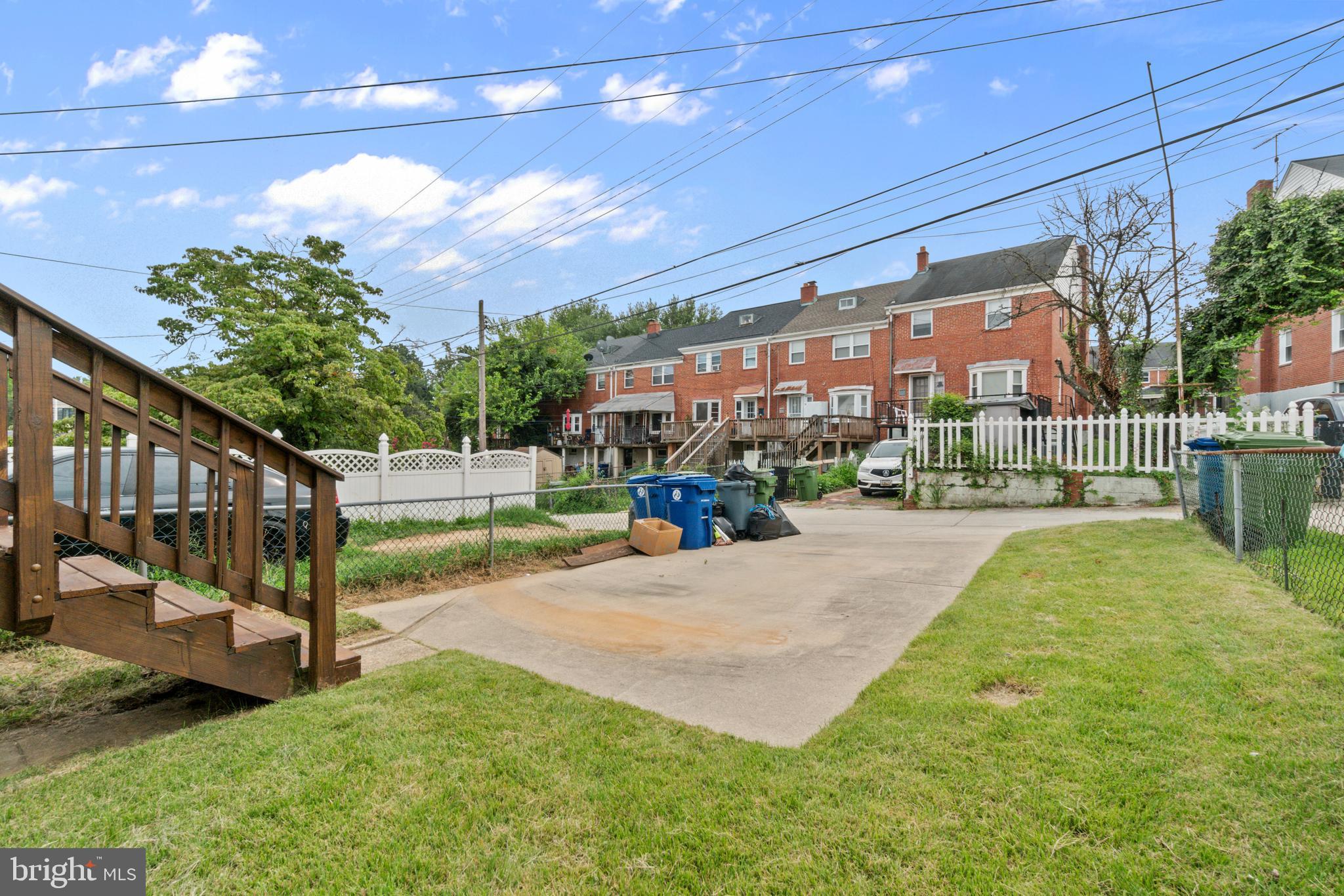 1909 Heathfield Road Baltimore, MD 21239 - Photo 20 of 22 a view of a building with a yard