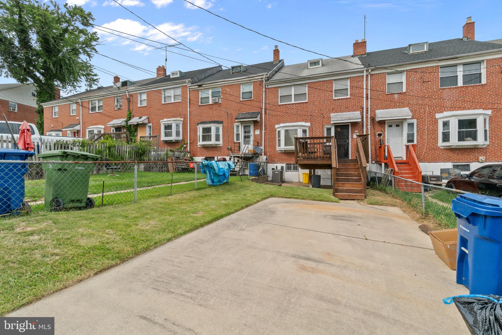 1909 Heathfield Road Baltimore, MD 21239 - Photo 22 of 22 a view of a building with a yard