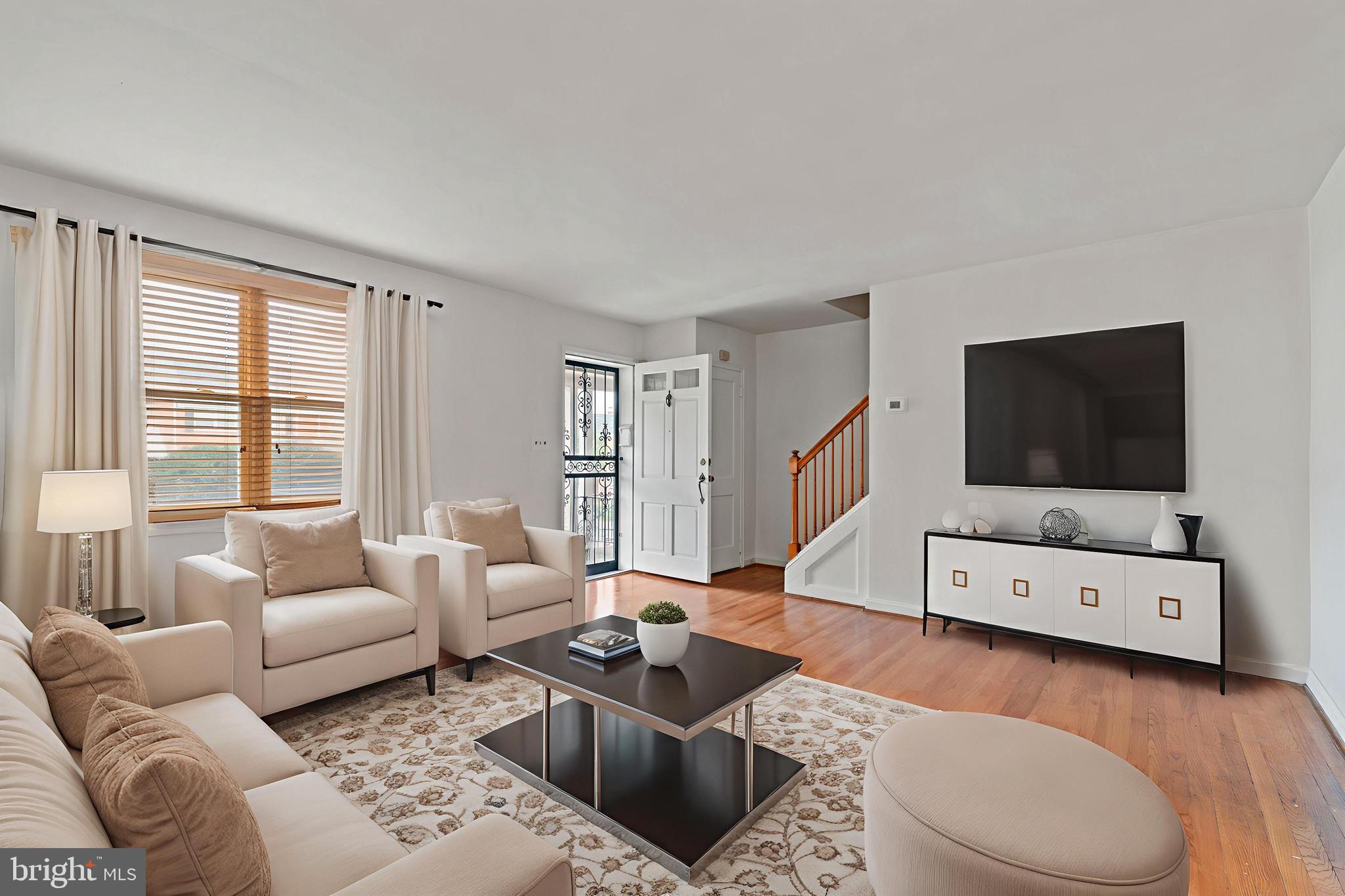 1909 Heathfield Road Baltimore, MD 21239 - Photo 3 of 22 a living room with furniture and a flat screen tv