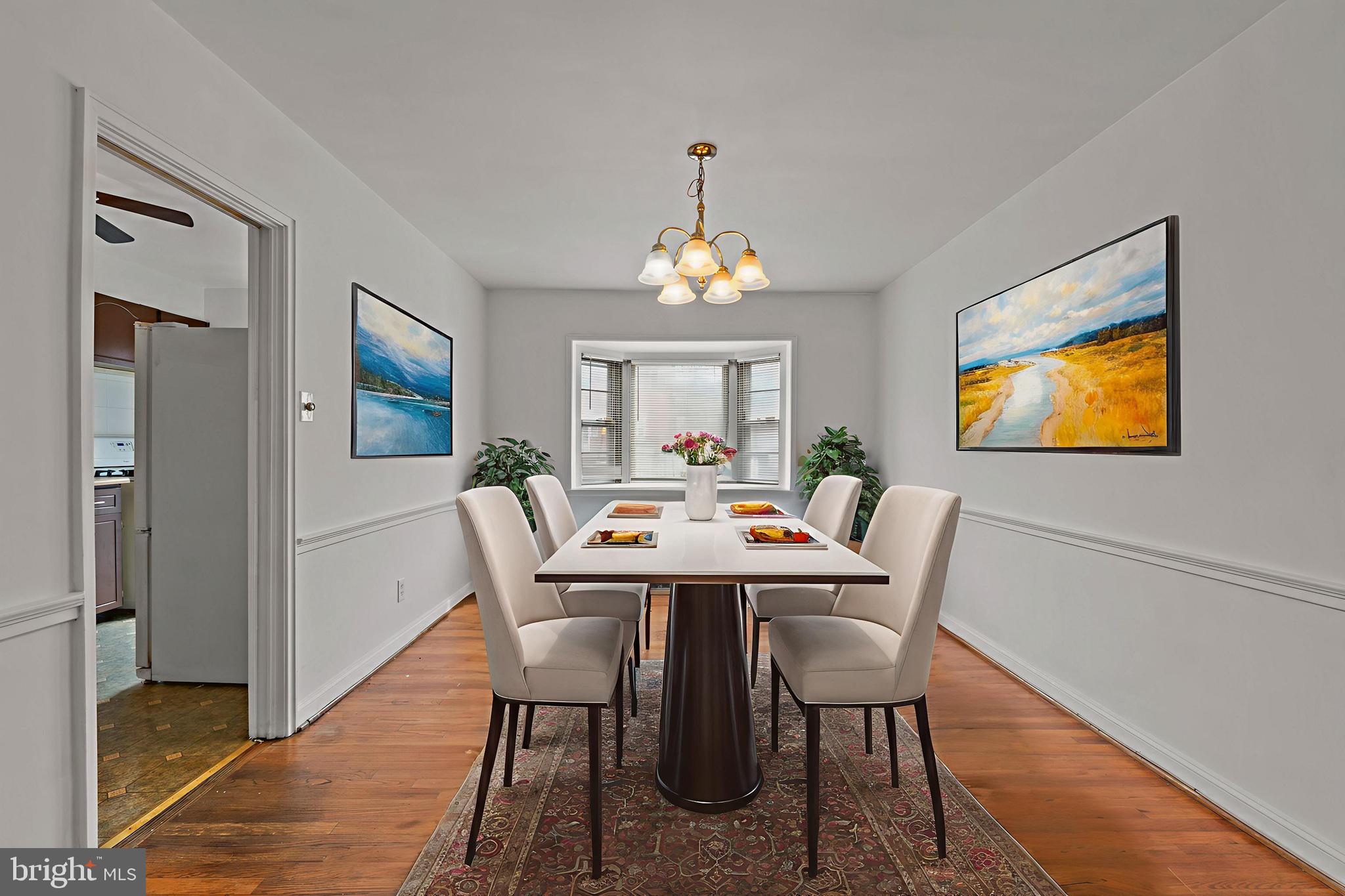 1909 Heathfield Road Baltimore, MD 21239 - Photo 4 of 22 a view of a dining room with furniture window and wooden floor