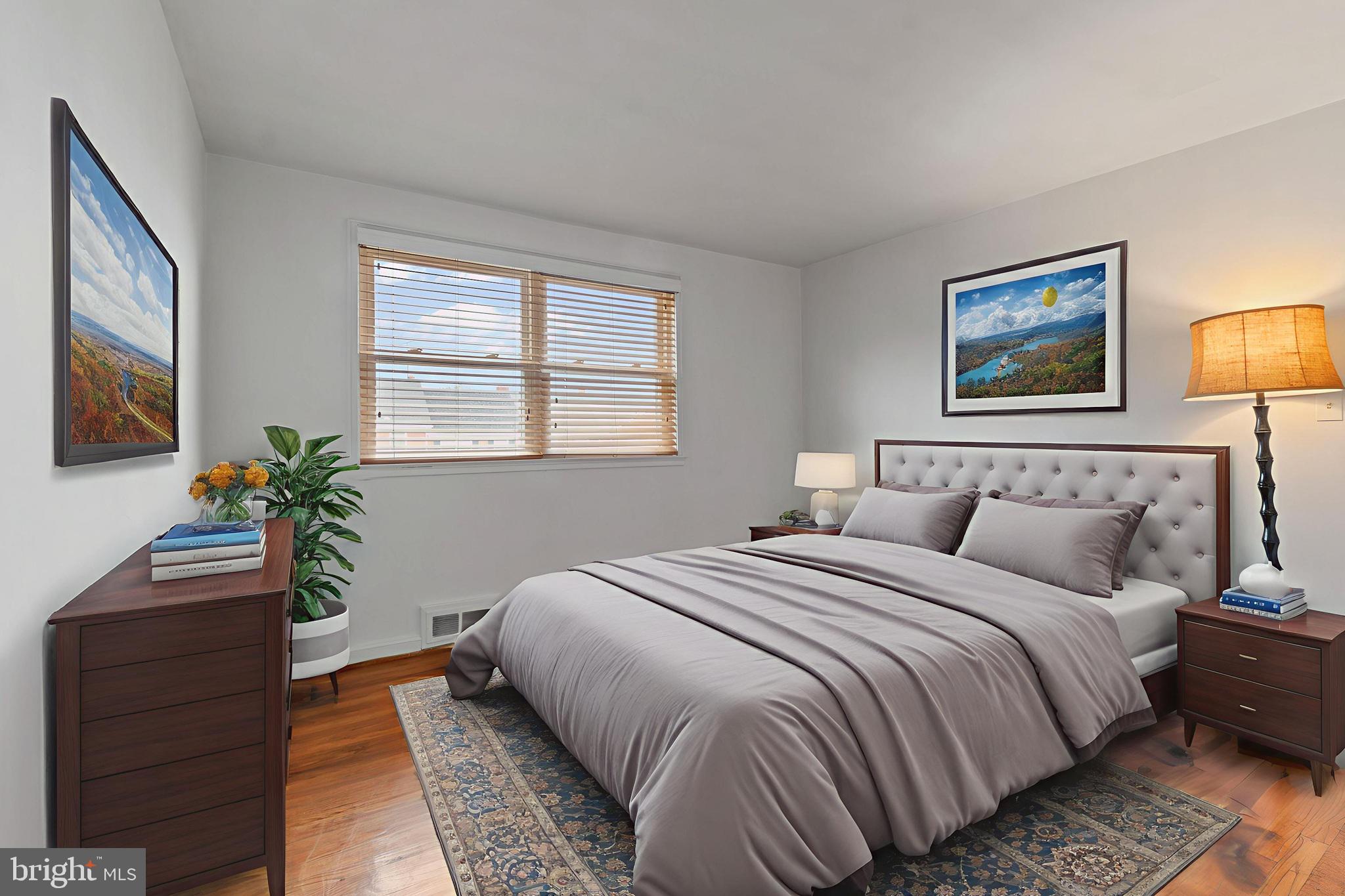 1909 Heathfield Road Baltimore, MD 21239 - Photo 8 of 22 a bedroom with bed and a potted plant