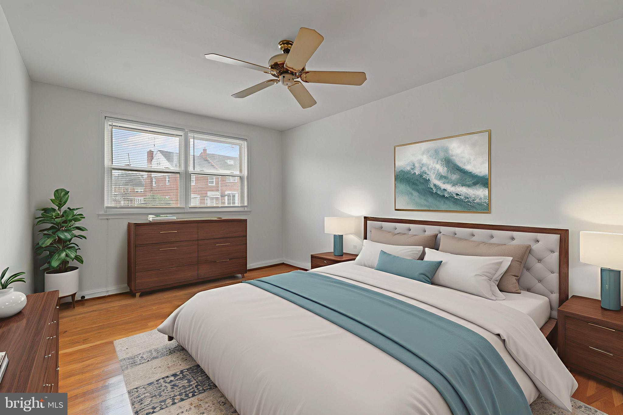 1909 Heathfield Road Baltimore, MD 21239 - Photo 9 of 22 a bedroom with a bed dresser and a window