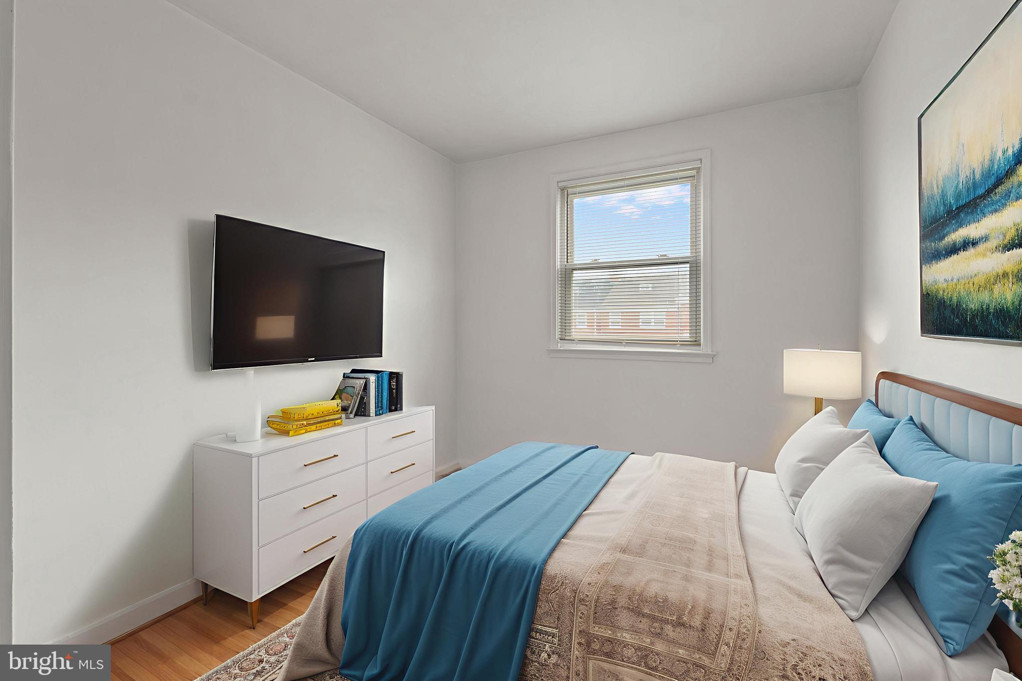 1909 Heathfield Road Baltimore, MD 21239 - Photo 10 of 22 a bedroom with a bed and a flat screen tv