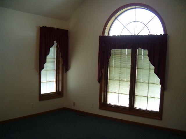 21626 Mill Road Prophetstown, IL 61277 - Photo 6 of 9 an empty room with wooden floor and a window