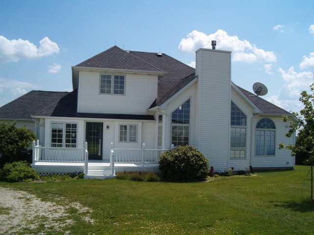 21626 Mill Road Prophetstown, IL 61277 - Photo 7 of 9 a front view of a house with a garden