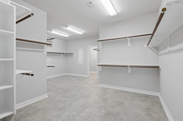 a view of an empty walk in closet