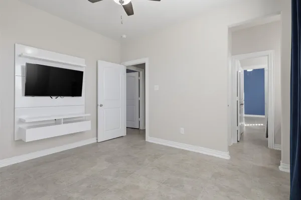 a view of an empty room and closet area