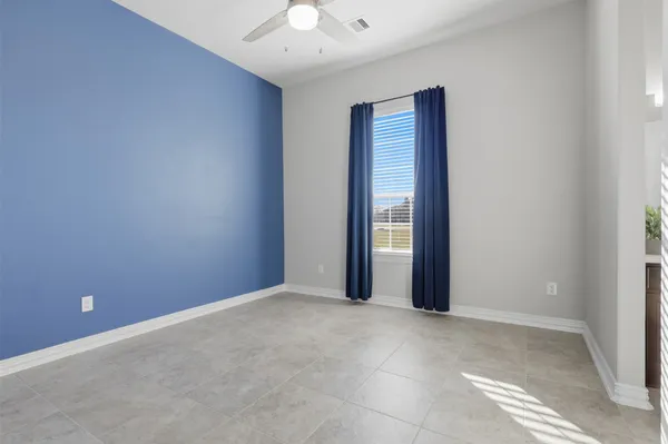 an empty room with windows and closet