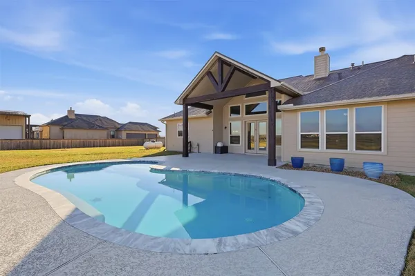 a view of a house with swimming pool