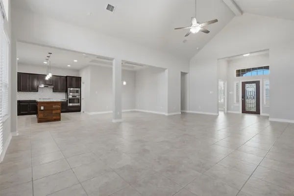a view of a kitchen with a sink and a chandelier fire place
