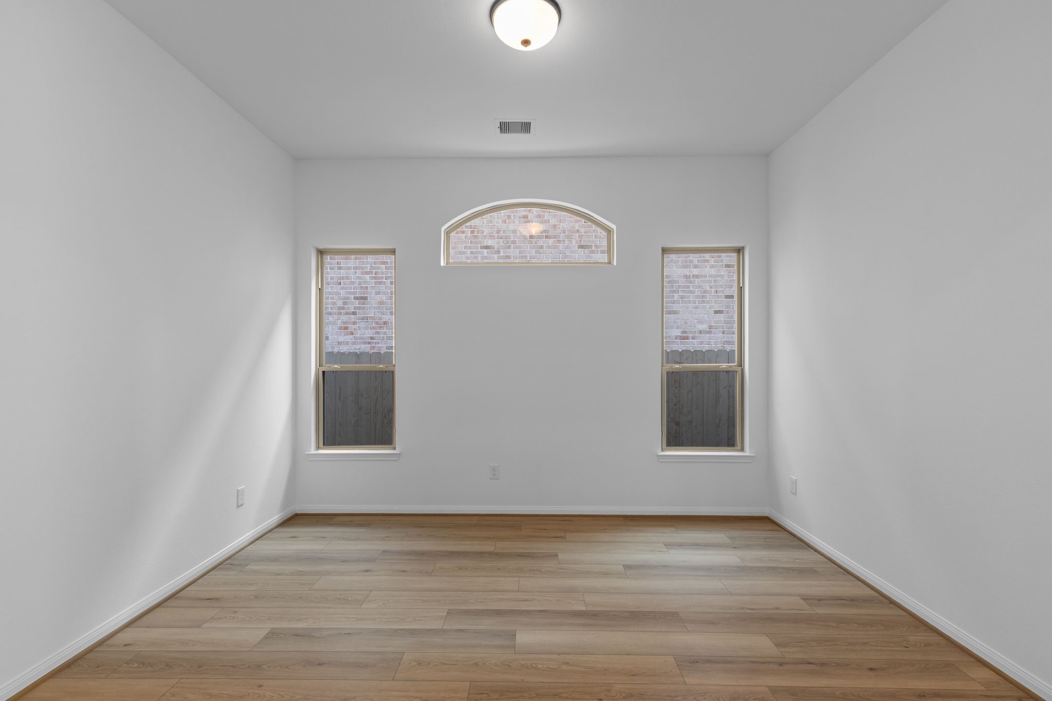 2518 Gleaming Pear Drive Manvel, TX 77578 - Photo 11 of 28 a view of a livingroom with wooden floor and window
