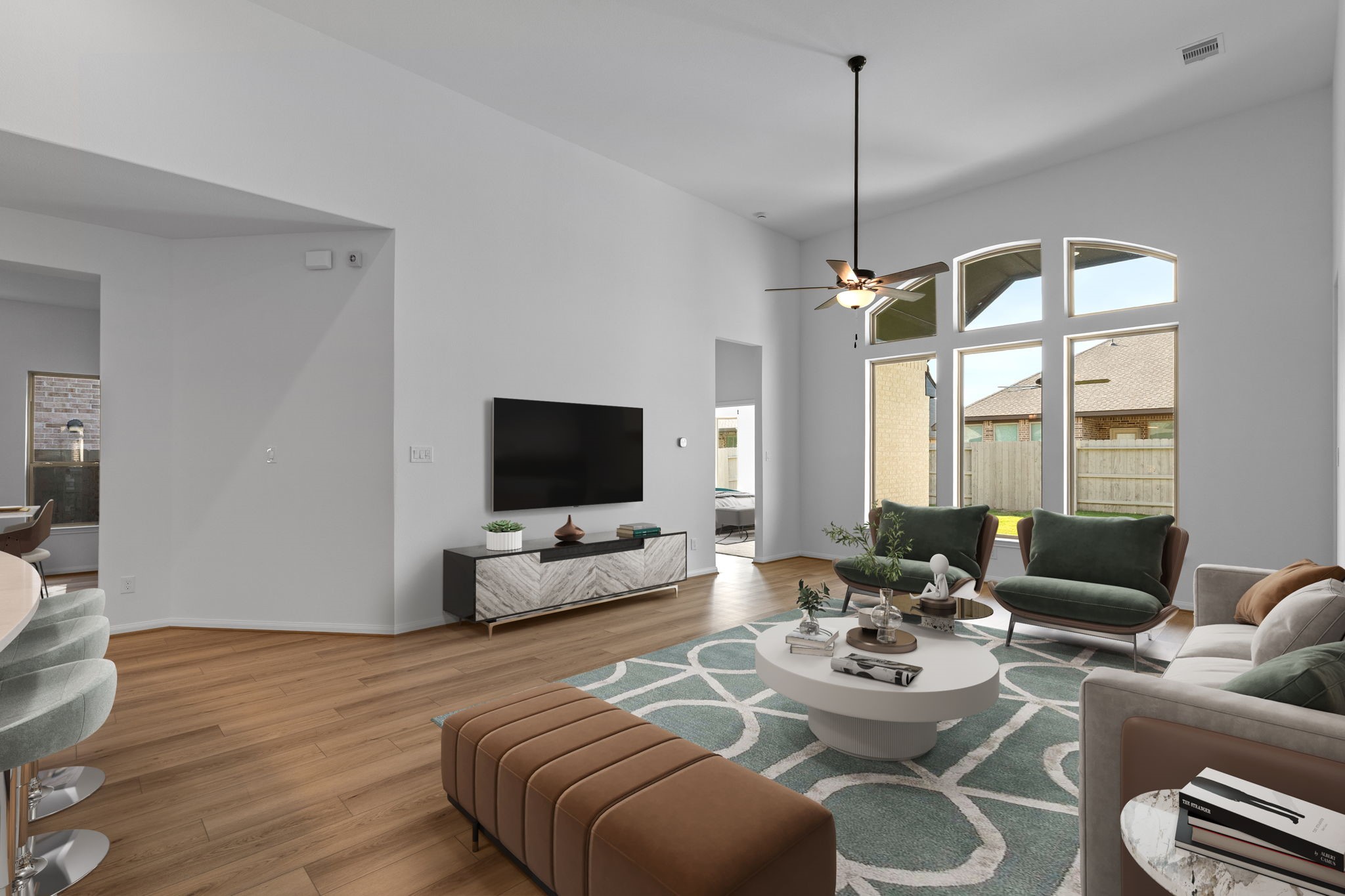 2518 Gleaming Pear Drive Manvel, TX 77578 - Photo 12 of 28 a living room with furniture a flat screen tv and a large window