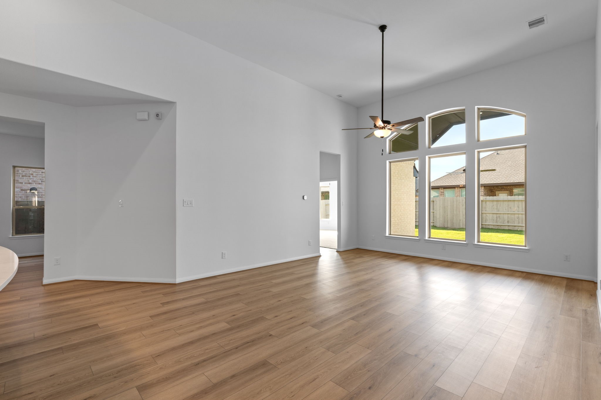 2518 Gleaming Pear Drive Manvel, TX 77578 - Photo 13 of 28 a view of a room with wooden floor and a window