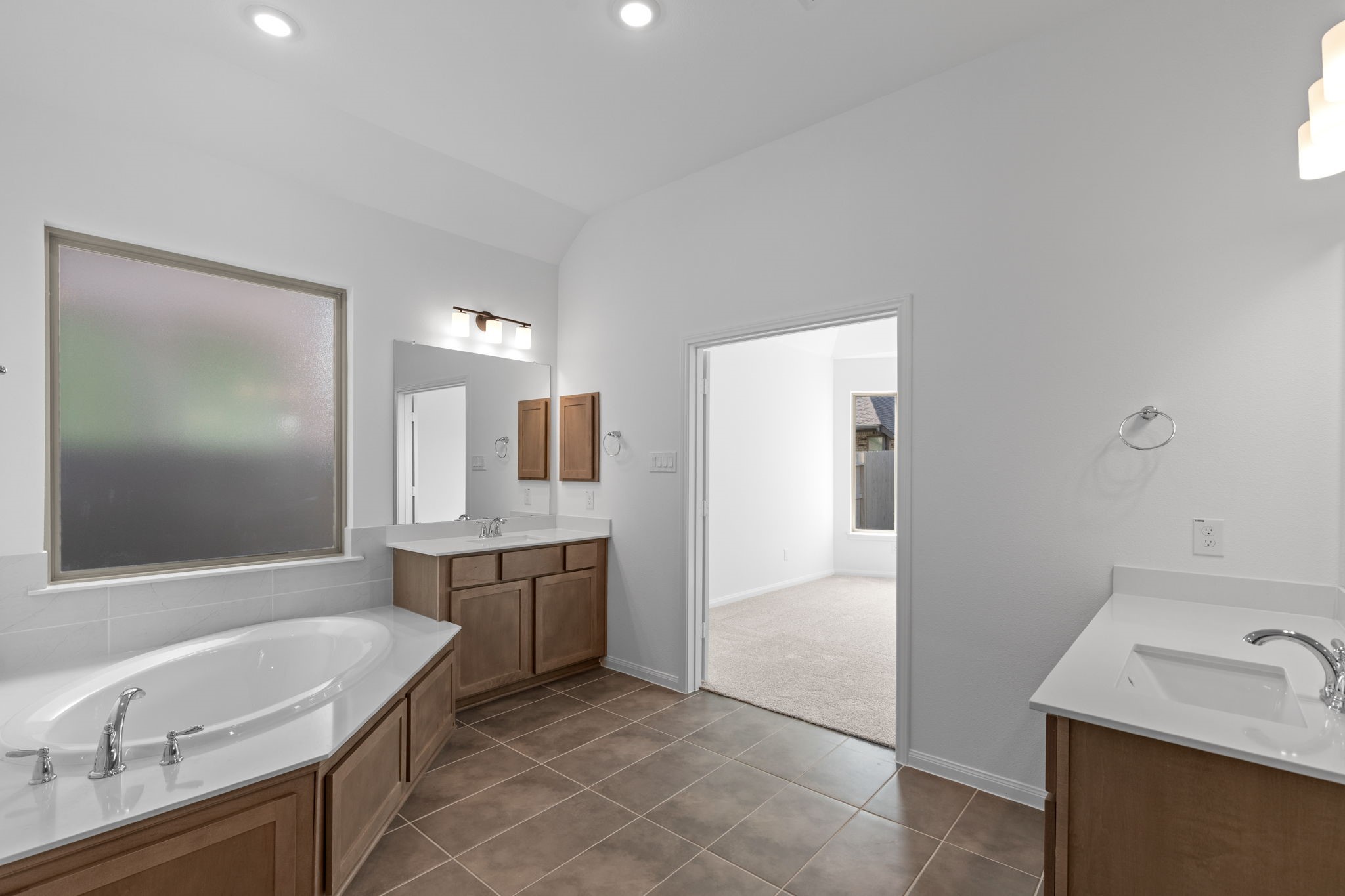 2518 Gleaming Pear Drive Manvel, TX 77578 - Photo 19 of 28 a bathroom with a granite countertop sink and a mirror