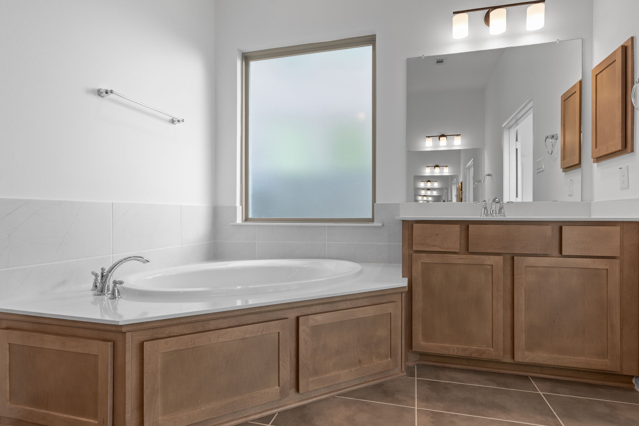 2518 Gleaming Pear Drive Manvel, TX 77578 - Photo 20 of 28 a bathroom with a sink and a mirror