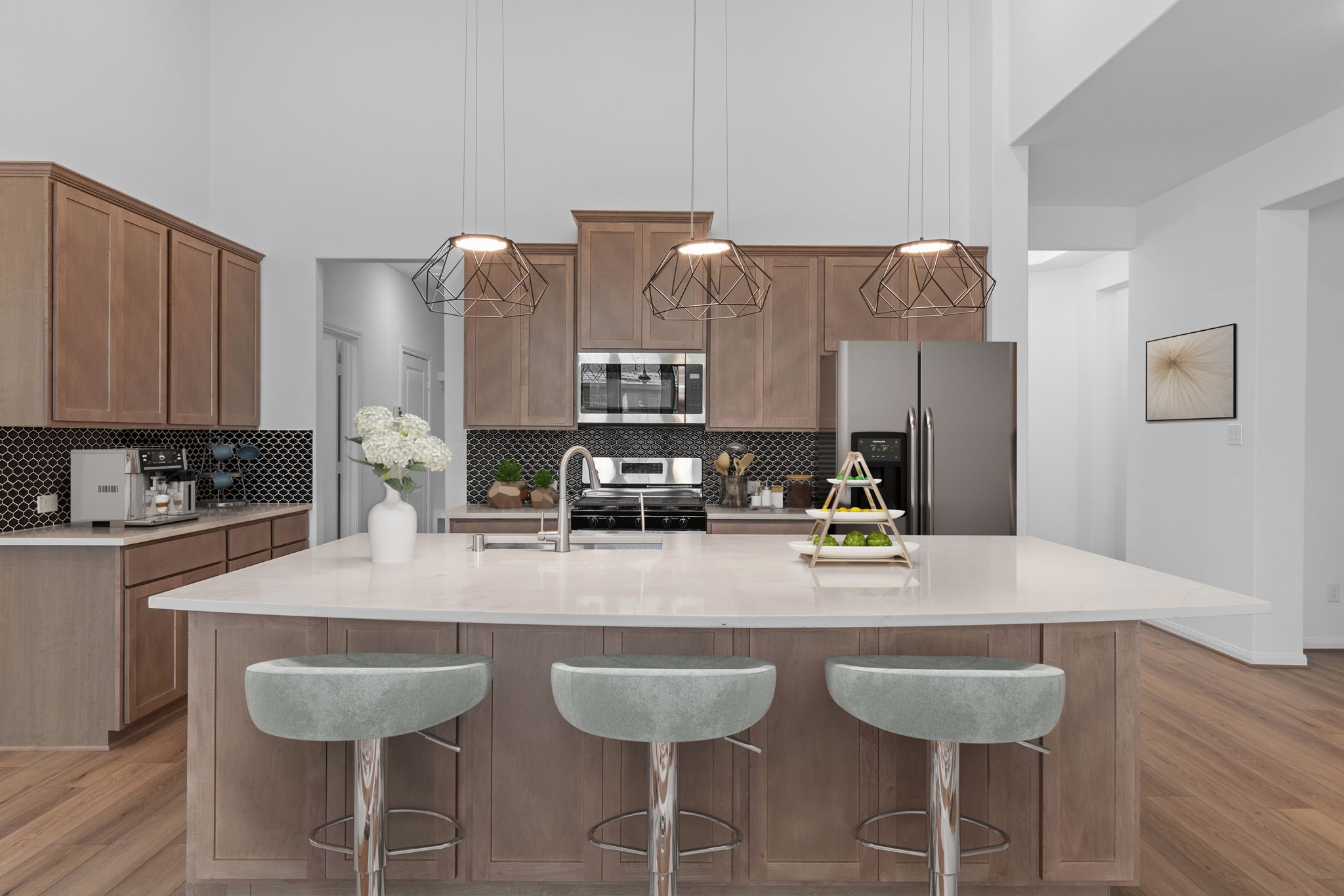 2518 Gleaming Pear Drive Manvel, TX 77578 - Photo 2 of 28 a kitchen with cabinets a counter space and chairs