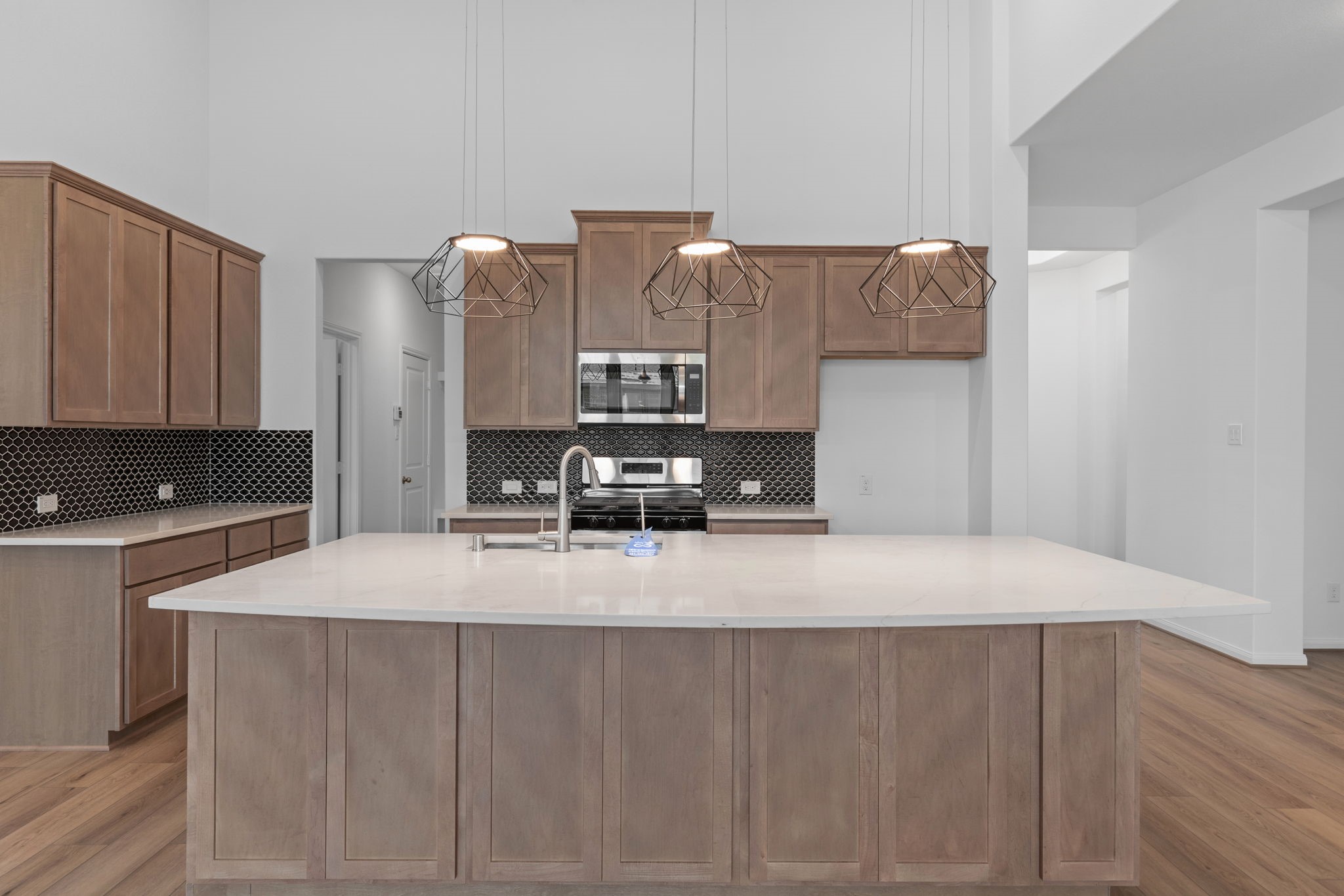 2518 Gleaming Pear Drive Manvel, TX 77578 - Photo 3 of 28 a large kitchen with cabinets