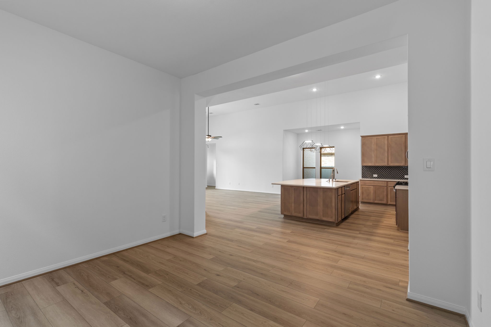 2518 Gleaming Pear Drive Manvel, TX 77578 - Photo 10 of 28 a view of a room with wooden floor and a cabinet