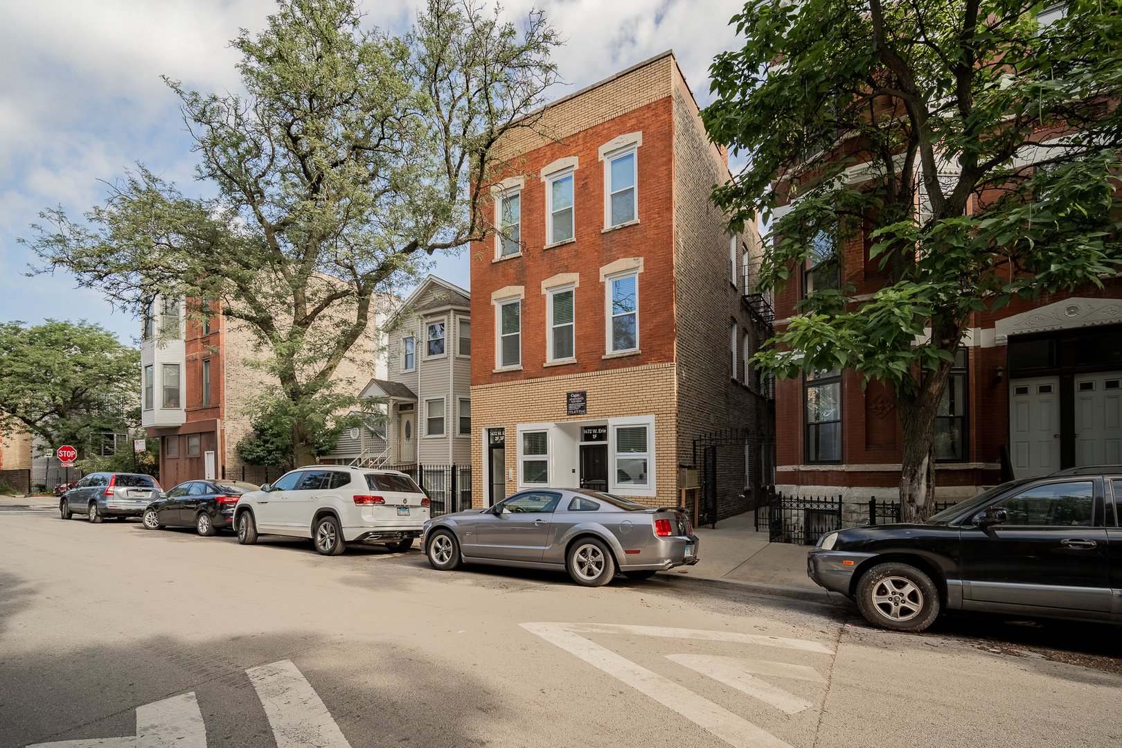1472 West Erie Street, Unit 2F Chicago, IL 60642 - Photo 1 of 25 a car parked in front of a building