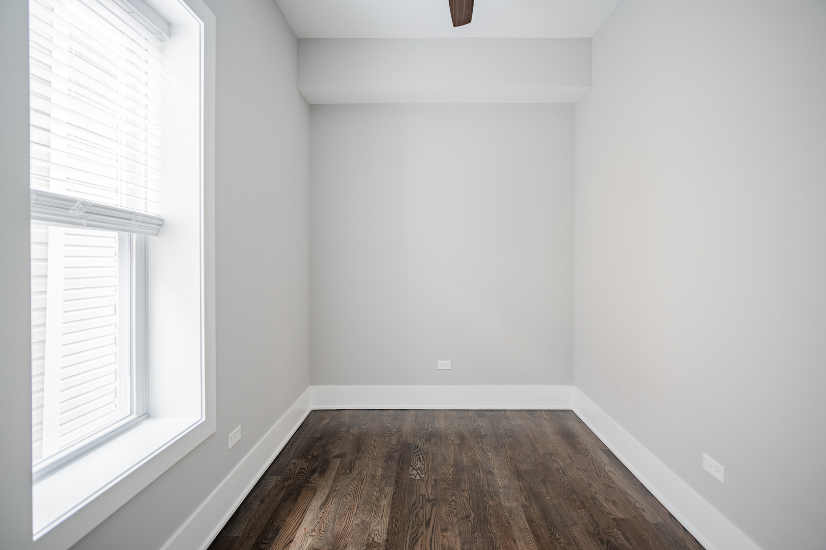1472 West Erie Street, Unit 2F Chicago, IL 60642 - Photo 11 of 25 a view of a small space with wooden floor and a window
