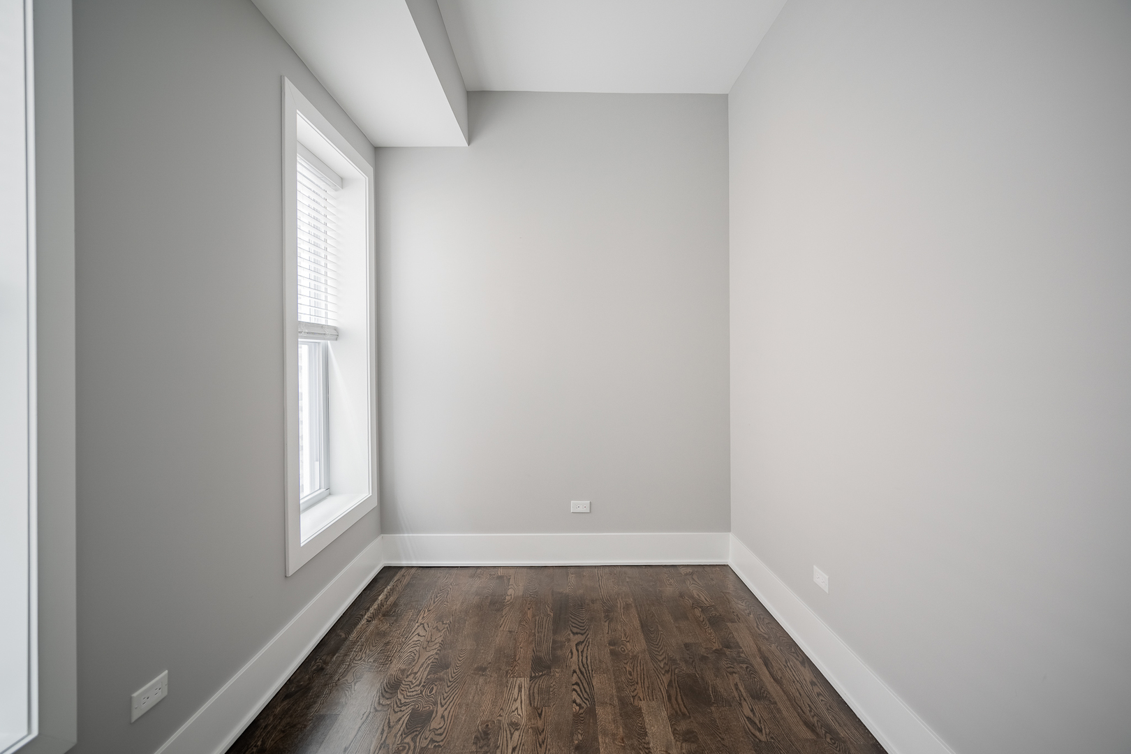 1472 West Erie Street, Unit 2F Chicago, IL 60642 - Photo 12 of 25 a view of a small space with wooden floor and a window