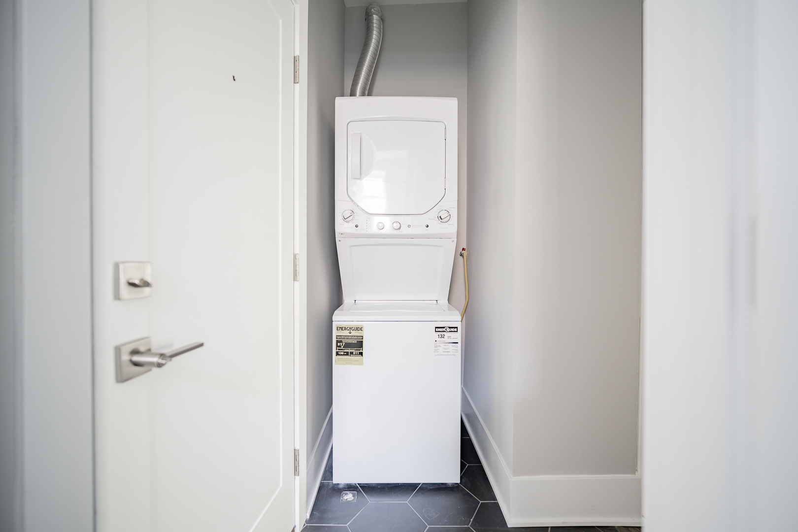 1472 West Erie Street, Unit 2F Chicago, IL 60642 - Photo 14 of 25 a view of a storage & utility room with a washer dryer