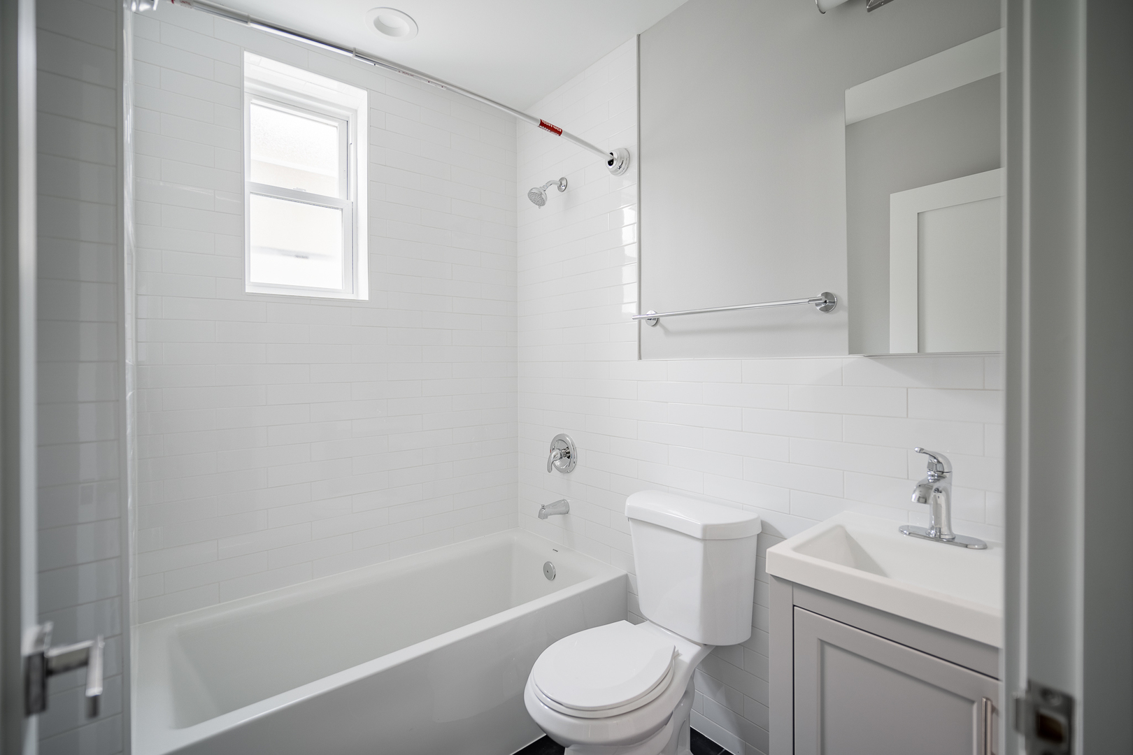 1472 West Erie Street, Unit 2F Chicago, IL 60642 - Photo 15 of 25 a bathroom with a sink toilet and shower