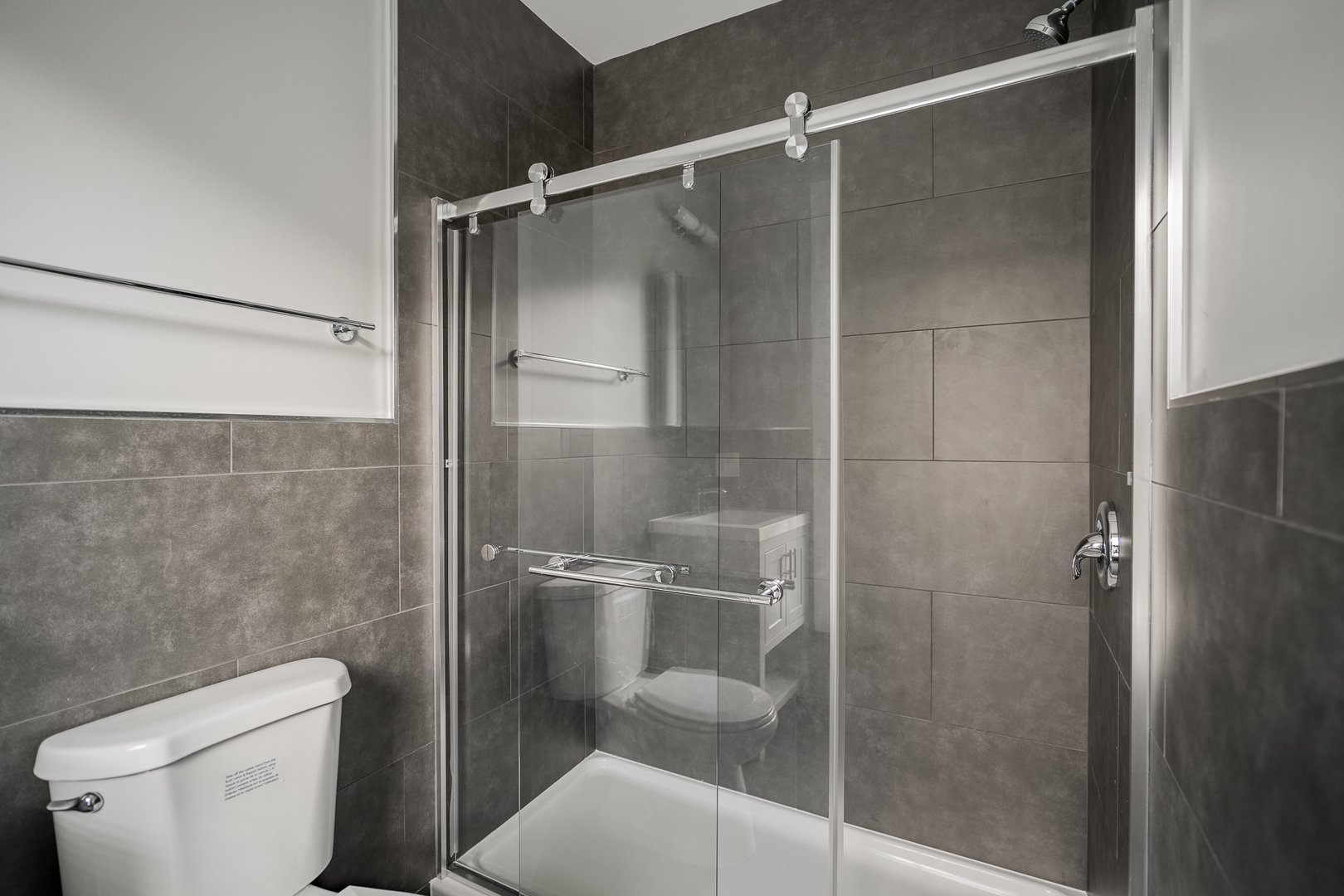 1472 West Erie Street, Unit 2F Chicago, IL 60642 - Photo 21 of 25 a bathroom with a shower and toilet