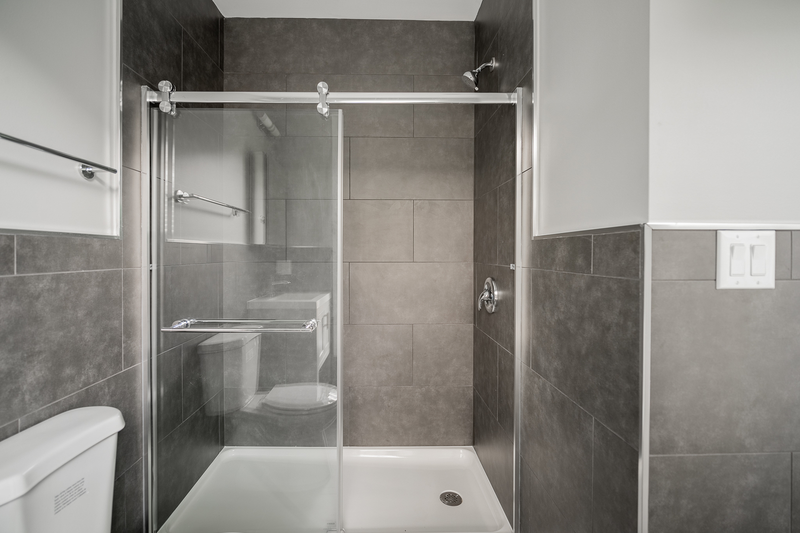 1472 West Erie Street, Unit 2F Chicago, IL 60642 - Photo 22 of 25 a bathroom with a shower and toilet