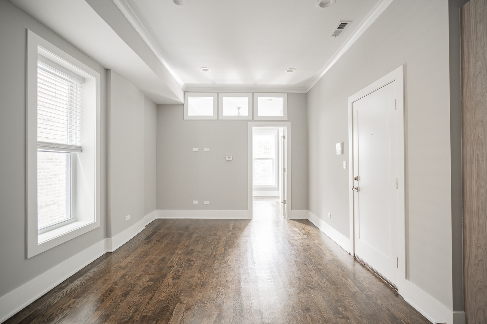 1472 West Erie Street, Unit 2F Chicago, IL 60642 - Photo 24 of 25 a view of entryway with wooden floor