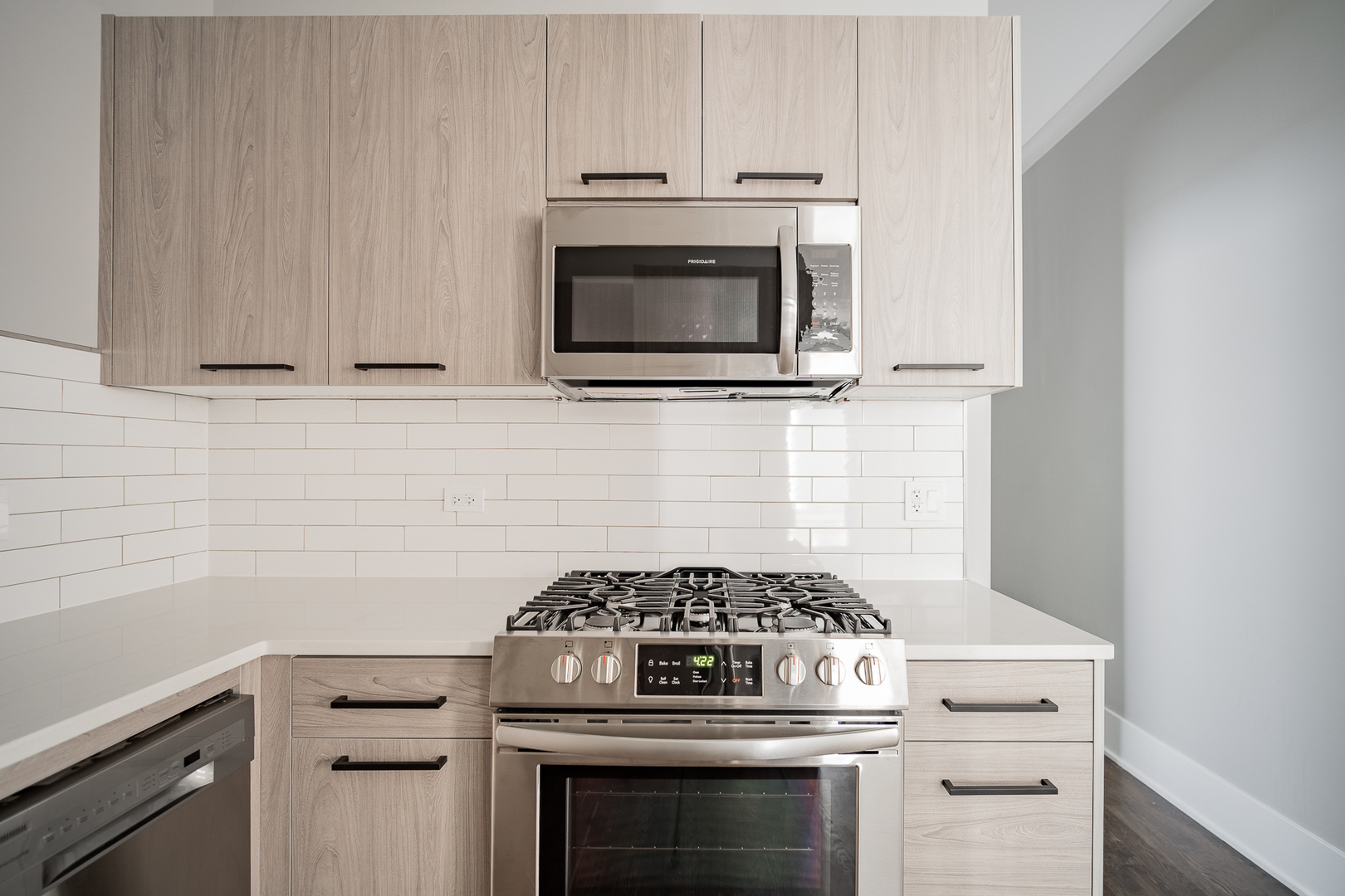 1472 West Erie Street, Unit 2F Chicago, IL 60642 - Photo 4 of 25 a stove top oven sitting inside of a kitchen