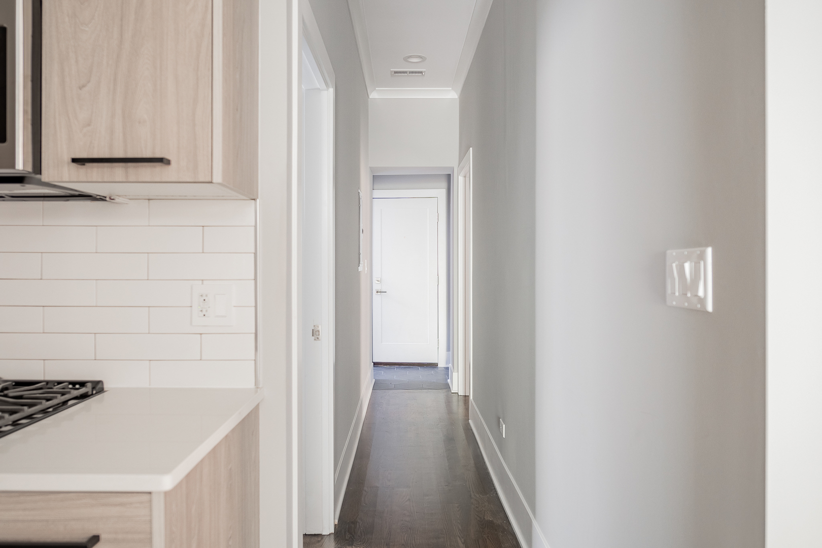 1472 West Erie Street, Unit 2F Chicago, IL 60642 - Photo 7 of 25 a view of a hallway with wooden cabinets