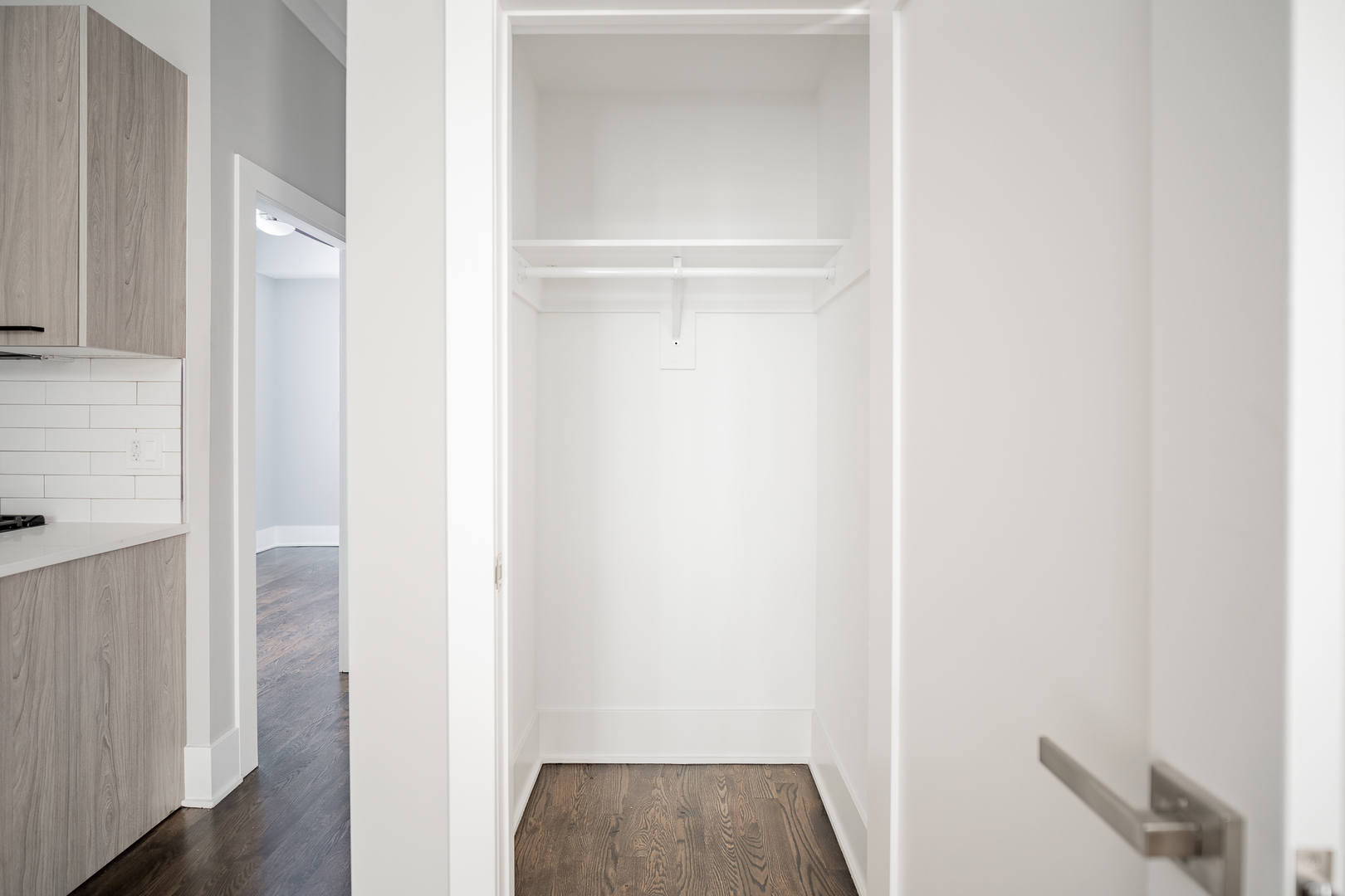 1472 West Erie Street, Unit 2F Chicago, IL 60642 - Photo 8 of 25 a view of hallway with closet and wooden floor