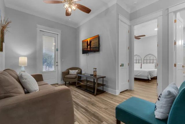 a living room with furniture and a flat screen tv