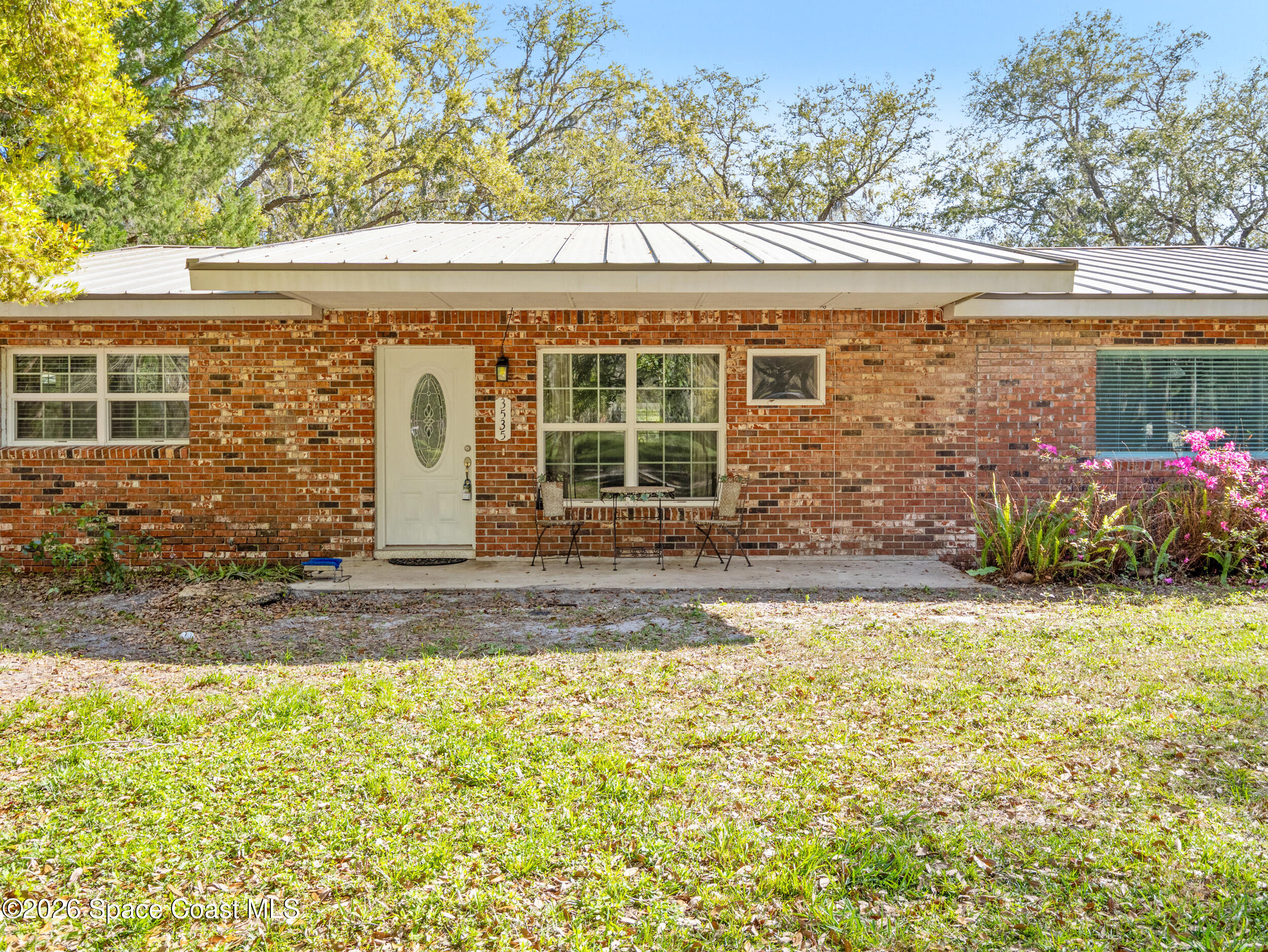 3535 Montgomery Road Mims, FL 32754 - Photo 51 of 53 a front view of a house with a yard