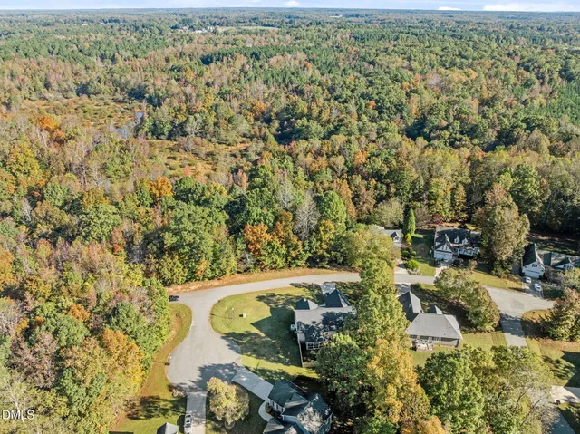 an aerial view of residential house with parking space