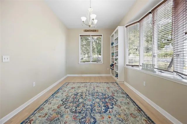 a kitchen with cabinets appliances a sink and a window