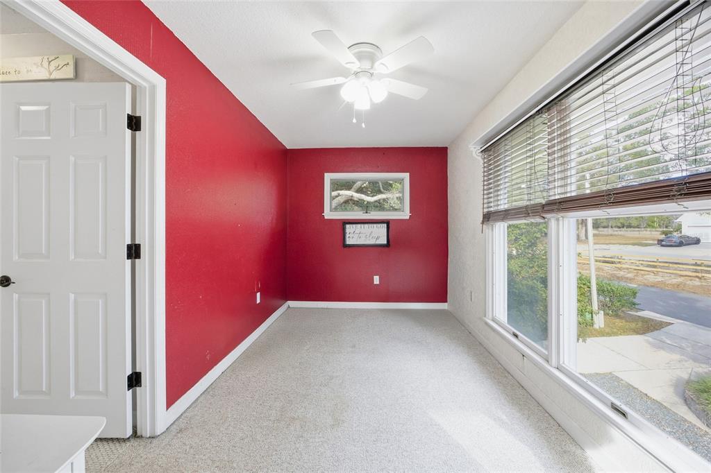 10400 Southeast 101st Avenue Road Belleview, FL 34420 - Photo 23 of 59 a very nice looking room with a ceiling fan