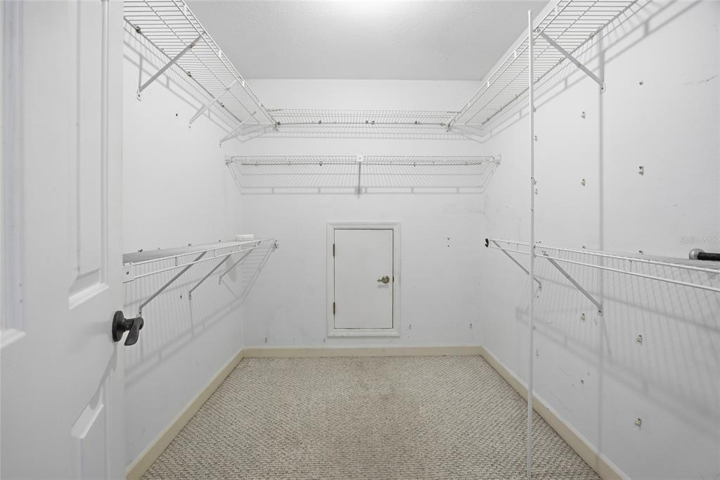 10400 Southeast 101st Avenue Road Belleview, FL 34420 - Photo 30 of 59 a view of storage and utility room with racks on the wall