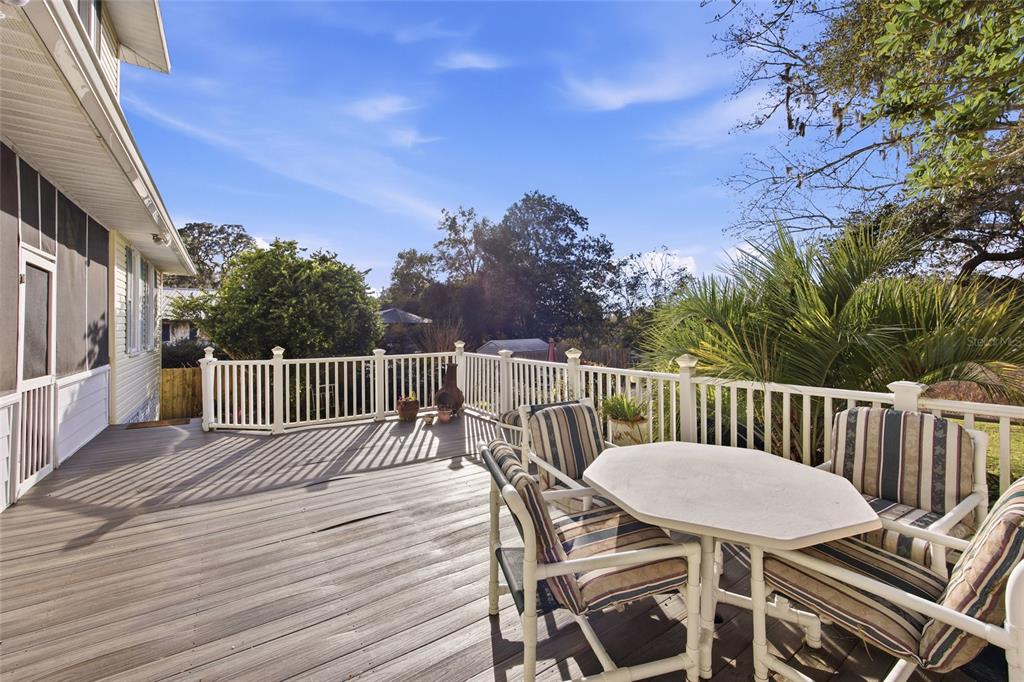 10400 Southeast 101st Avenue Road Belleview, FL 34420 - Photo 33 of 59 a view of a chairs and table on the wooden floor