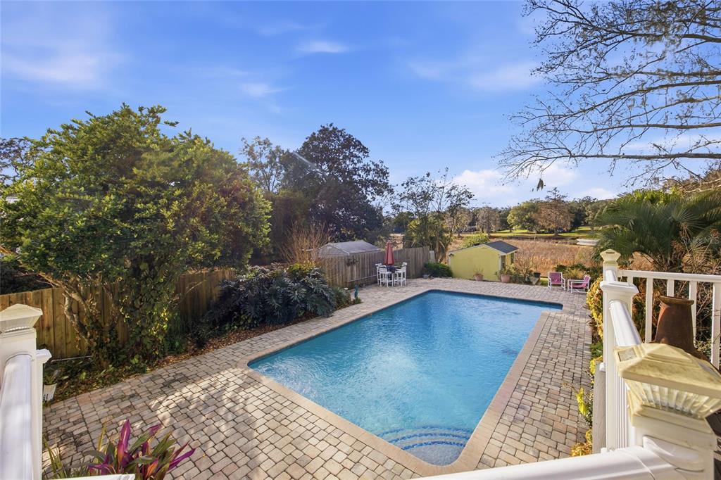 10400 Southeast 101st Avenue Road Belleview, FL 34420 - Photo 34 of 59 a view of a swimming pool with a lounge chair
