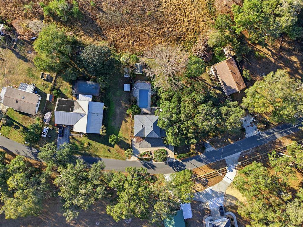 10400 Southeast 101st Avenue Road Belleview, FL 34420 - Photo 51 of 59 an aerial view of a house with a yard and garden