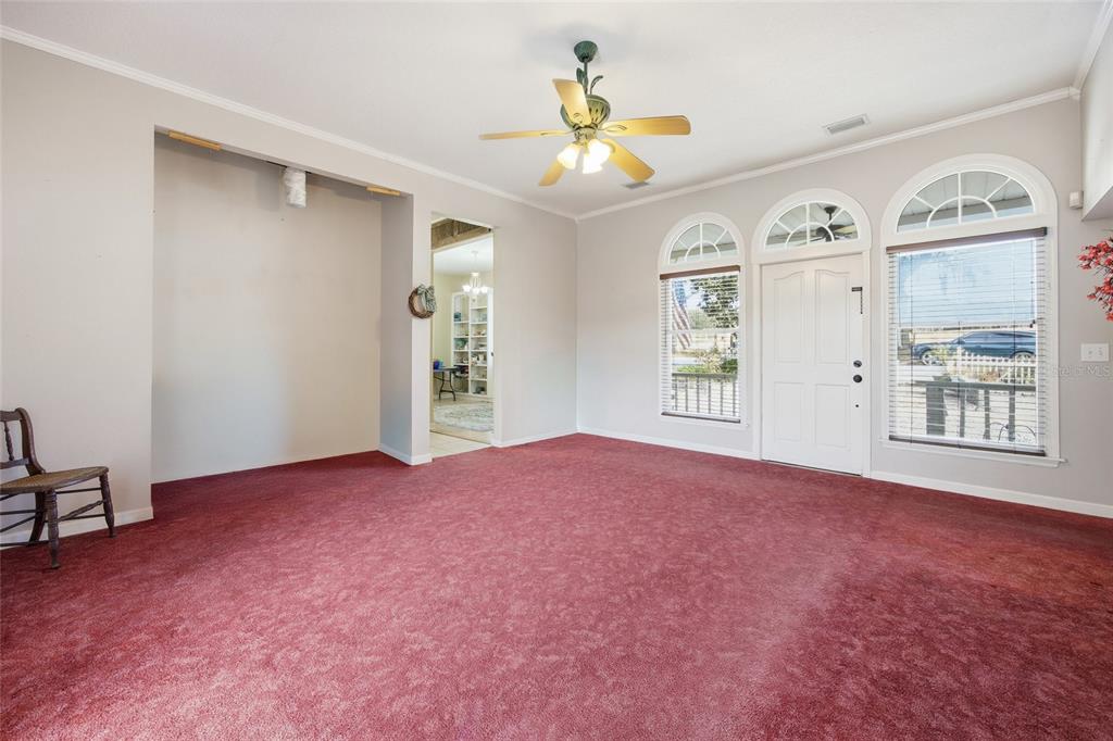 10400 Southeast 101st Avenue Road Belleview, FL 34420 - Photo 7 of 59 a view of an empty room with a window